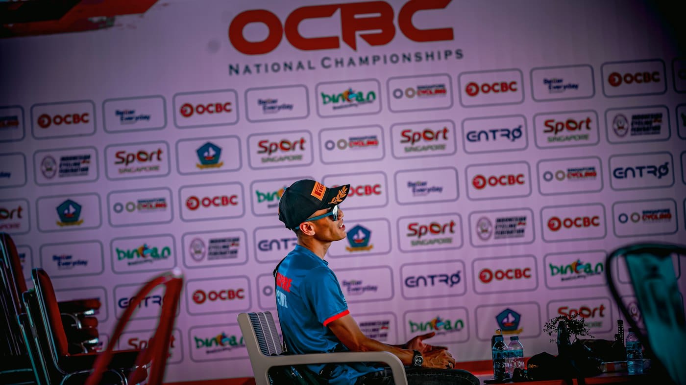 A man sits at an ocbc national championship event